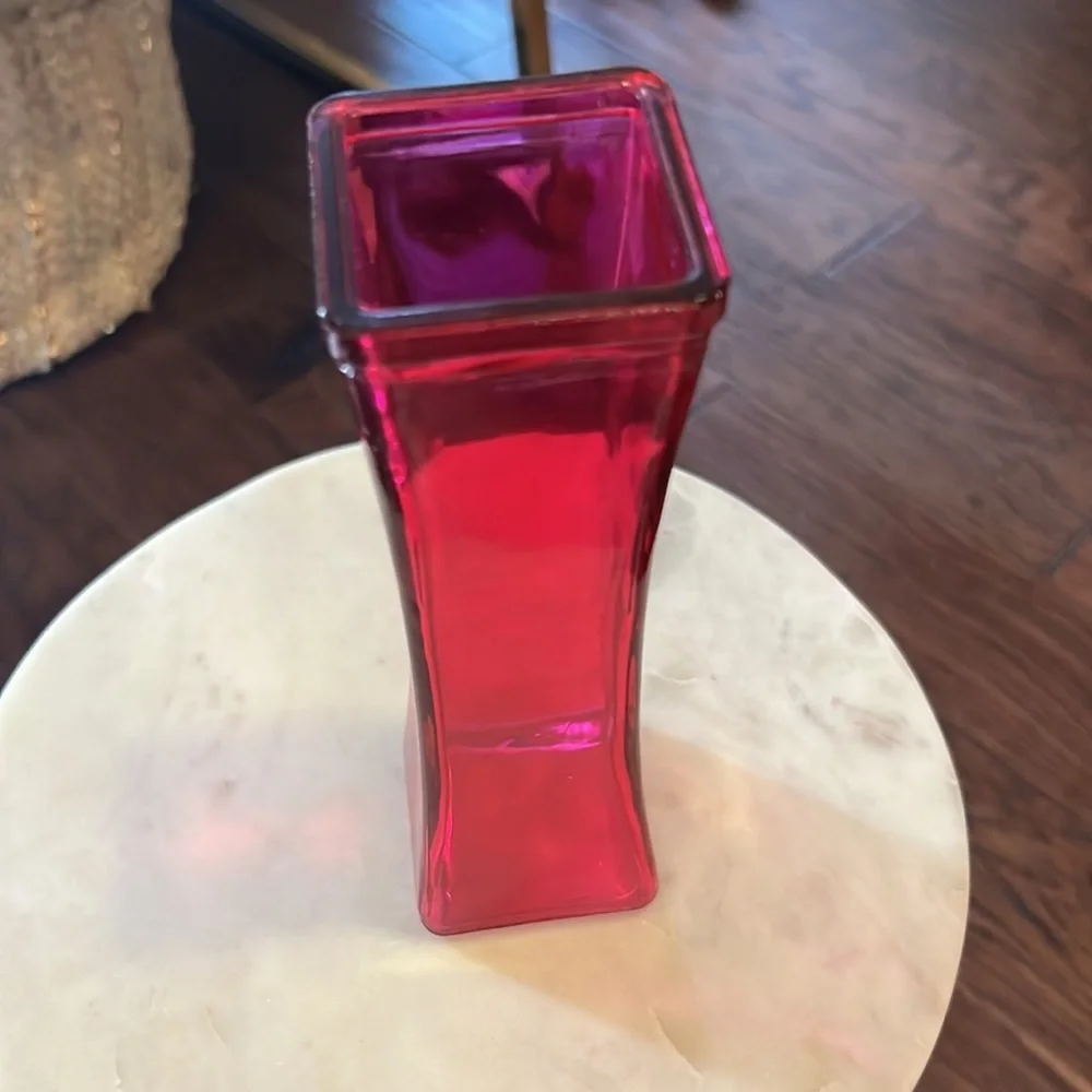 Pink glass narrow 7.5” tall 2.25” wide at widest part top & bottom, 1.75” middle
